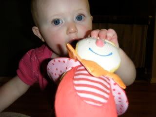 Ellerie with the Beetle Trixie clutch toy