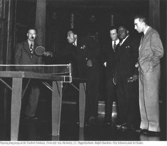 Pete Johnson watches J.C. Higginbotham win the table-tennis competition at the Turkish Embassy...