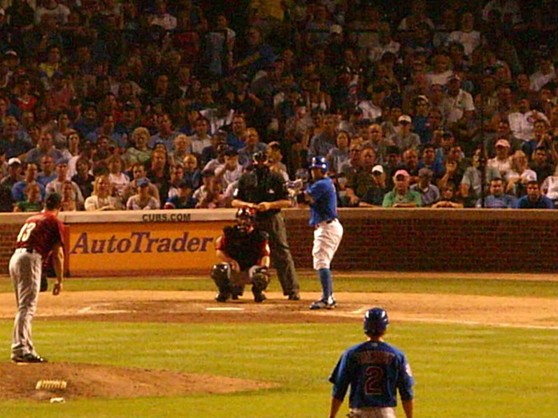 cubs fan green shirt pink hat